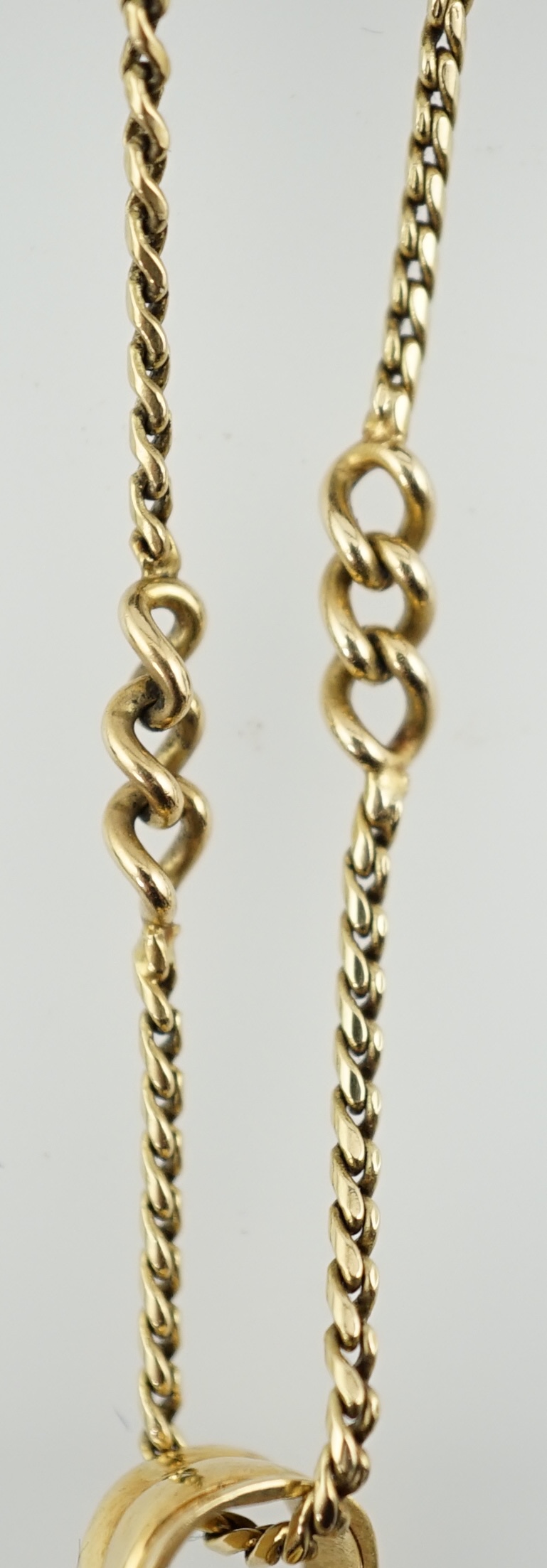 An Art Deco 18ct gold mounted black onyx and diamond set openwork drop pendant